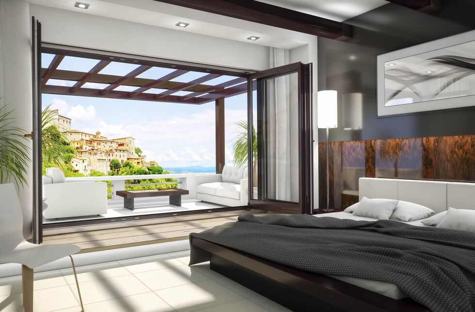 Holz Faltschiebetür in Nussbaum zur Terrasse